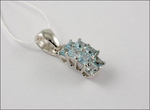 Серебряный кулон с топазом 22559 купить в магазине Самоцветы мира