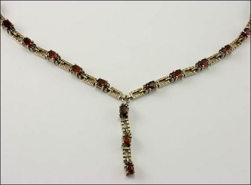 Серебряное колье с гранатом 23584 купить в магазине Самоцветы мира