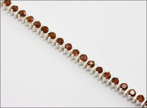 Серебряное колье с гранатом 28962 купить в магазине Самоцветы мира