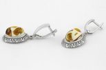 Серьги из мельхиора с янтарём овал 9х13 мм 60885